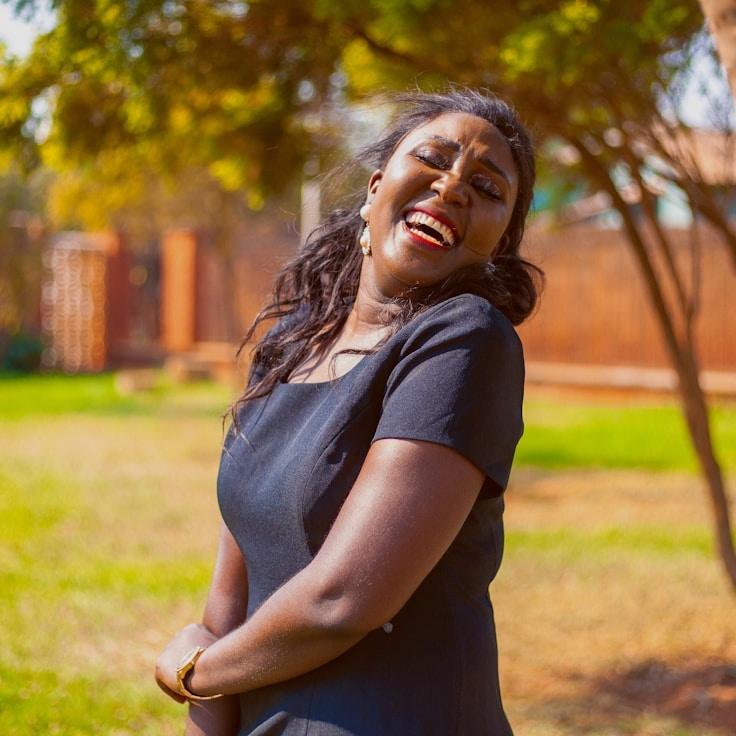 Kaveri Mehta, Lead Design Curator at PrimeGrovePaper, reviewing corporate floral arrangements